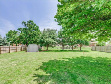 The backyard is large and fenced-in and had a big 