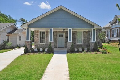 Front  This 3 bed, 2 bath home boasts upscale tile