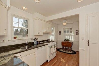Kitchen with custom cabinetry and custom counterto