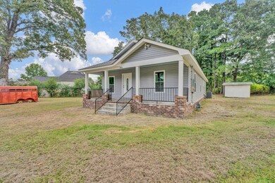 Bungalow-style house featuring a front lawn, a sto