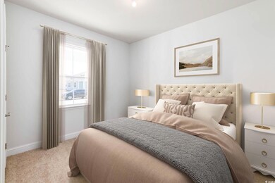 Bedroom featuring carpet and baseboards