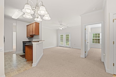 Kitchen, living room featuring ceiling fan with no