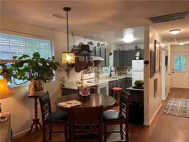Dining area and view of kitchen.