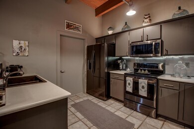 Kitchen with tasteful backsplash, stainless steel 