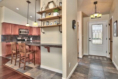 The entry is clad in 18-inch tile flooring, and th