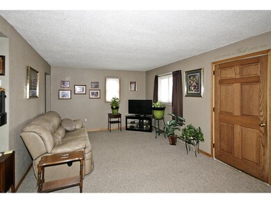 Living room and dining room with newer carpet.