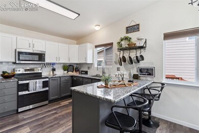 Kitchen with appliances with stainless steel finis