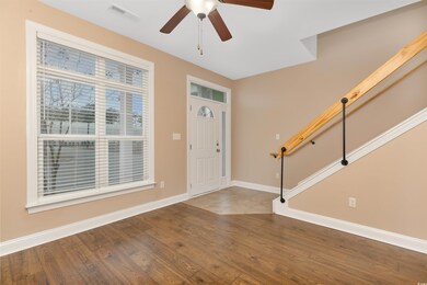 Entrance foyer featuring wood-type flooring and ce