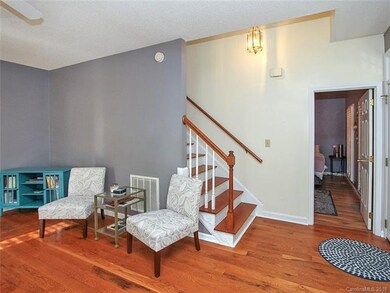 Great Room w/ View of door to Master Bed and Stair