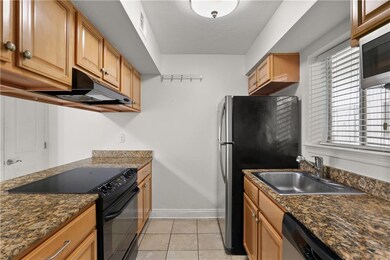 Kitchen with granite counters and stainless steel