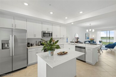 Kitchen featuring stainless steel appliances, white cabinetry, recessed lighting, and light tile patterned floors