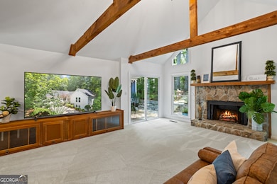 all anchored by a stone, gas log fireplace adding warmth and charm