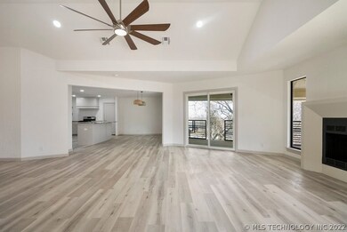 Vaulted ceilings open to covered patio