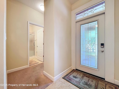 Foyer toward bathroom and bedroom