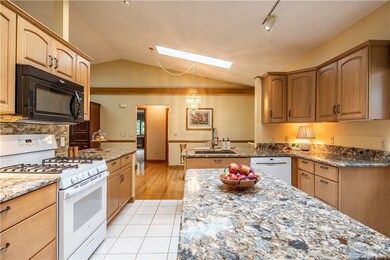 Beautiful bright kitchen with granite countertops