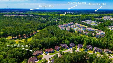Aerial view of residential area featuring a heavily wooded area