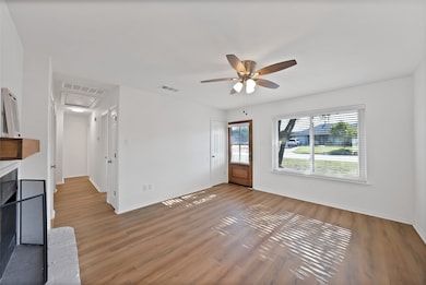 Updated open concept living room with fireplace