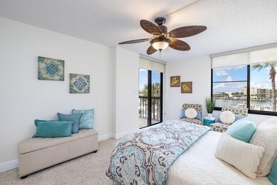 Master bedroom offers balcony access, water views