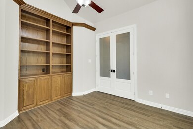 Study view 1 with Built ins and french doors off the front entry