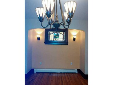 Dining Room. Original stained glass window, sconce