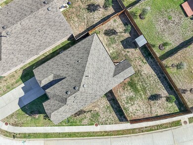 Property sits on a corner lot with a large fenced backyard.