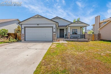 Craftsman inspired home with an attached garage, driveway, and a porch