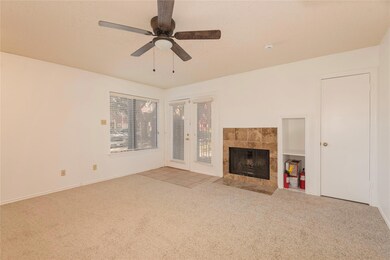 Living area view front kitchen to front door.