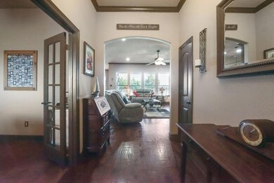 An entryway with elegant hand-scraped hardwood flooring.
