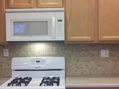 Kitchen. The mosaic backsplash really completes th