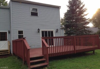 Back view of house with large deck