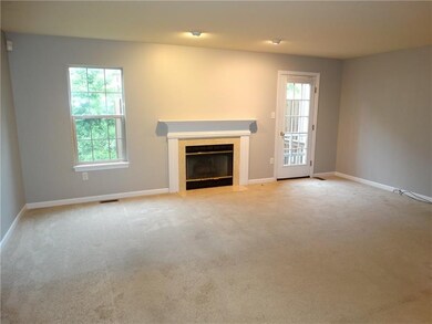 Gas fireplace in the living room with mantel and a