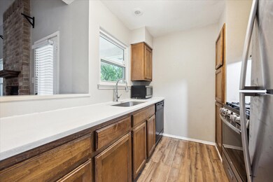 Kitchen with stainless steel appliances, a sink, 