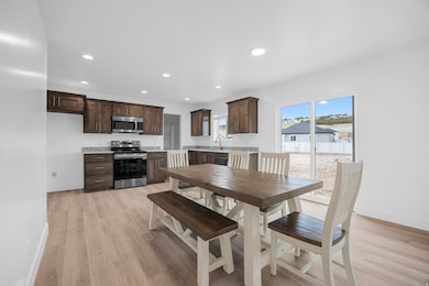 Dining area featuring recessed lighting and light wood-style floors