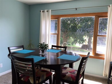 The dining room has a view of the front yard so yo