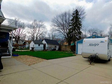 Backyard. CONCRETE DRIVEWAY. WELL KEPT GARDENING. 