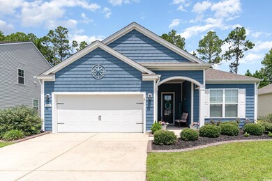 View of front facade featuring a garage and a fron
