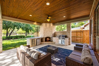 Enjoy some of the best views in the neighborhood w no back neighbors from the custom back patio extension with a built-in grill, limestone outdoor fireplace, and travertine tile.