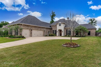 French provincial home featuring a garage and a fr
