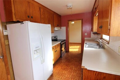 Kitchen with dining room through door ahead.