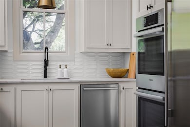 Kitchen featuring a sink, appliances with stainle