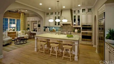 Beautiful open kitchen floor plan with large kitchen island and bar seating- as shown in model