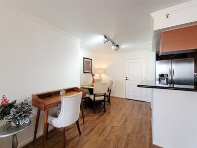 Well-lit, open-plan space featuring a dining area