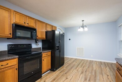 New waterproof vinyl flooring and light fixture for you eat-in kitchen.