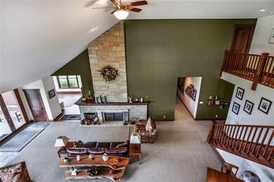 2 story family room with stone fireplace