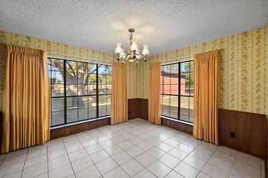 Large kitchen windows overlook the backyard!