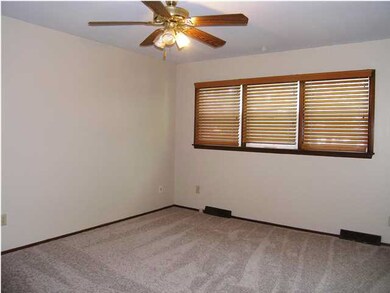 The master bedroom offers a comforting ceiling fan