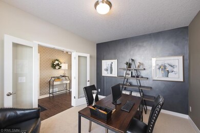 Spacious front flex room with French doors for privacy. Your option to add French doors or leave open as a flex room or front living room.