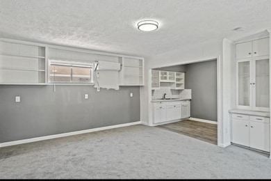 Notice all of the original woodwork, shelving, and storage.