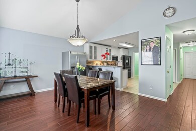 Dining area with hardwood / wood-style flooring an