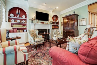 The gas fireplace in the family room is flanked on